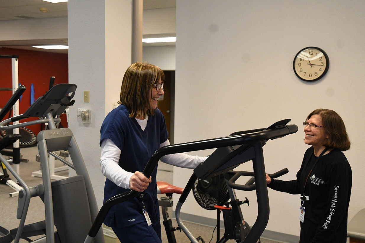 Maureen Roseland gets tips from Janice Wielenga